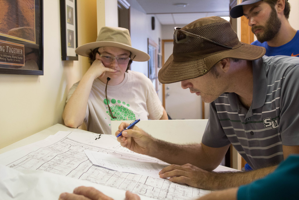 (From left to right) Emily Neiderman, Jason Evans and Adam Carr are mapping out vulnerable areas in Satellite Beach. Photo by Rhiannon Boyer