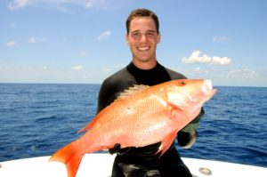 Mike Sipos on boat with large mutton snapper.