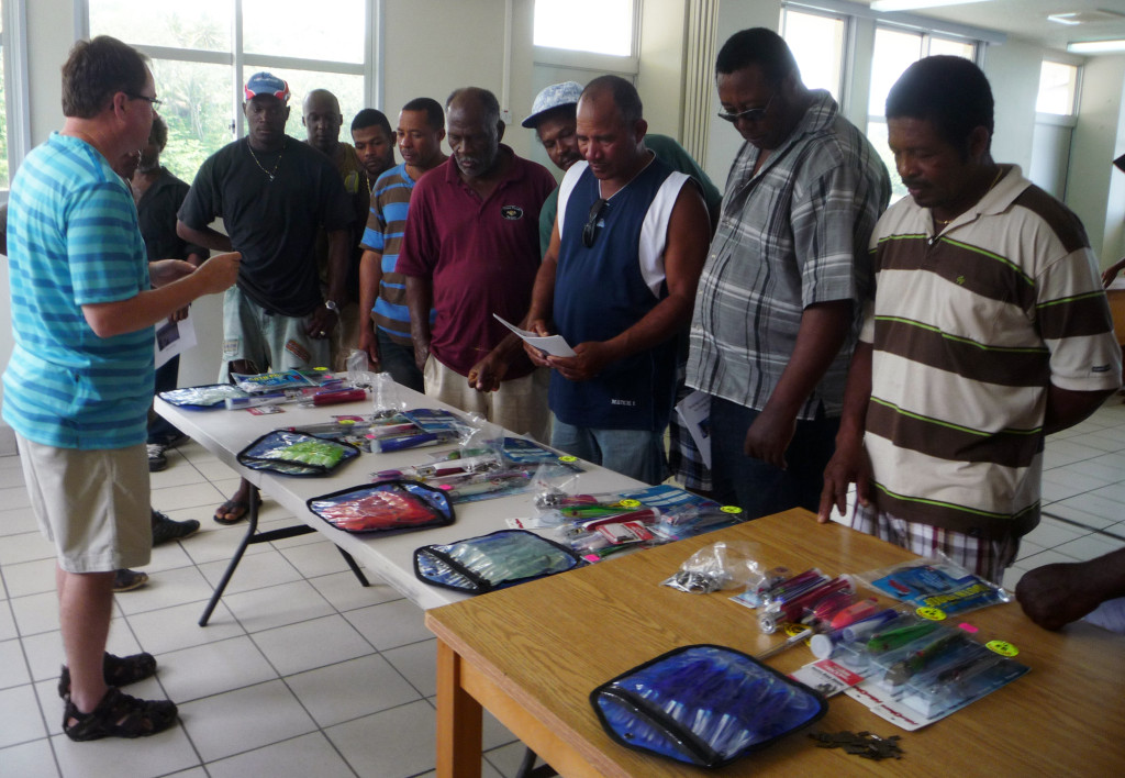 Charles Sidman presents the various artificial lure options to the local fishermen in Dominica. 