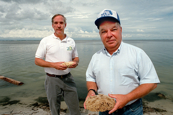 don sweat and john stevely hold sponges in hand
