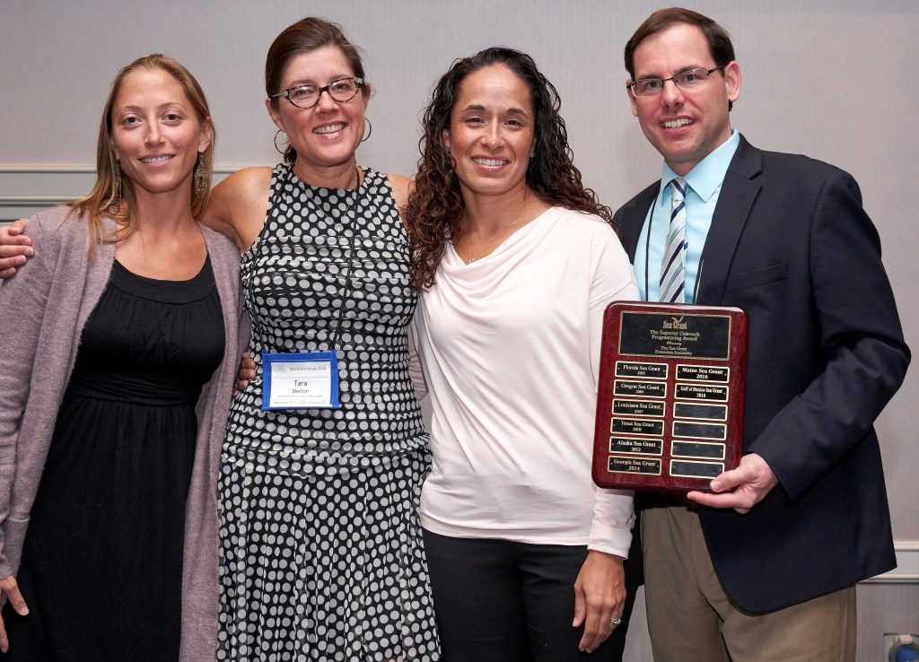 The Sea Grant Gulf of Mexico Oil Spill Science Outreach Team receives the National Superior Outreach Programming Award in Portland. Pictured are Chris Hale, left, Tara Skelton, Monica Wilson and Steve Sempier. (Photo by James Dewhirst)
