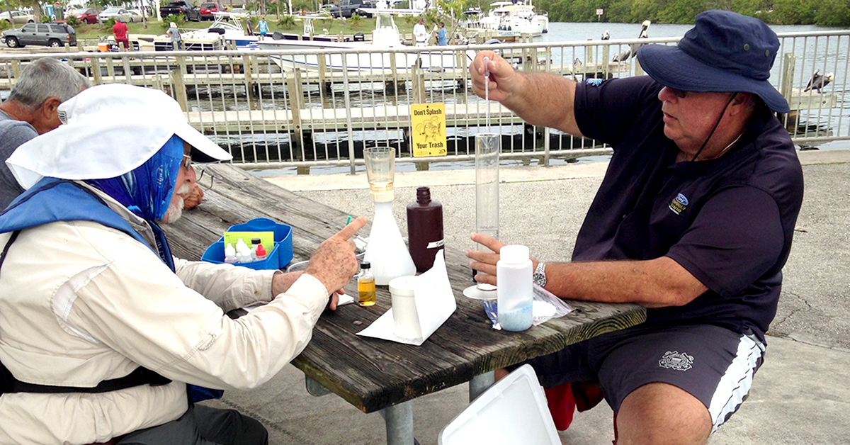 Volunteer filtering water samples